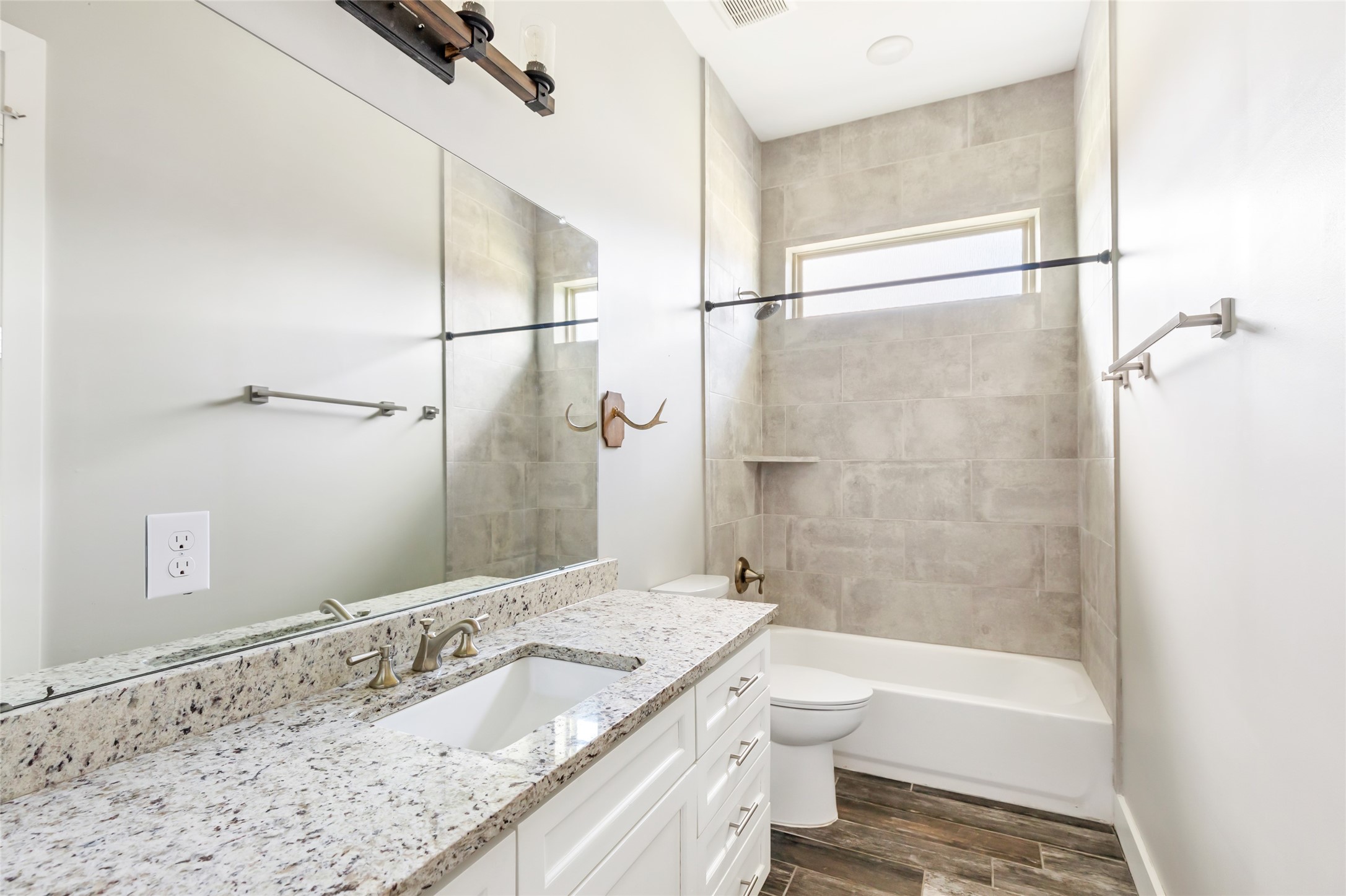 9006 Water Buck Lane Conroe, TX 77303 - Photo 47 of 48 a bathroom with a granite countertop bathtub shower sink vanity and toilet