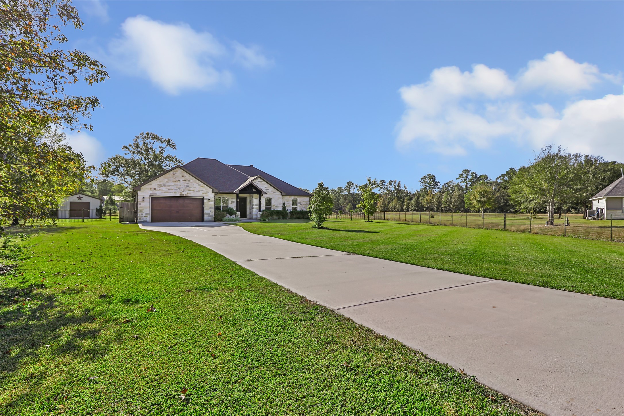 9006 Water Buck Lane Conroe, TX 77303 - Photo 5 of 48 a view of green field with house in the background