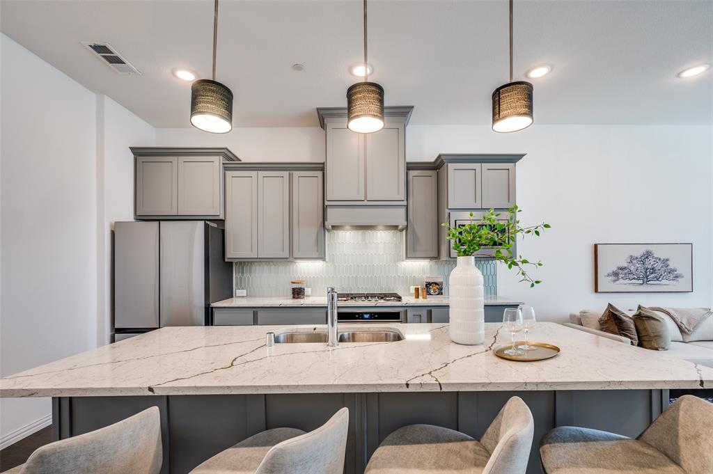 3718 Pelican Rst Way Arlington, TX 76005 - Photo 1 of 37 a kitchen with stainless steel appliances granite countertop a sink and white cabinets