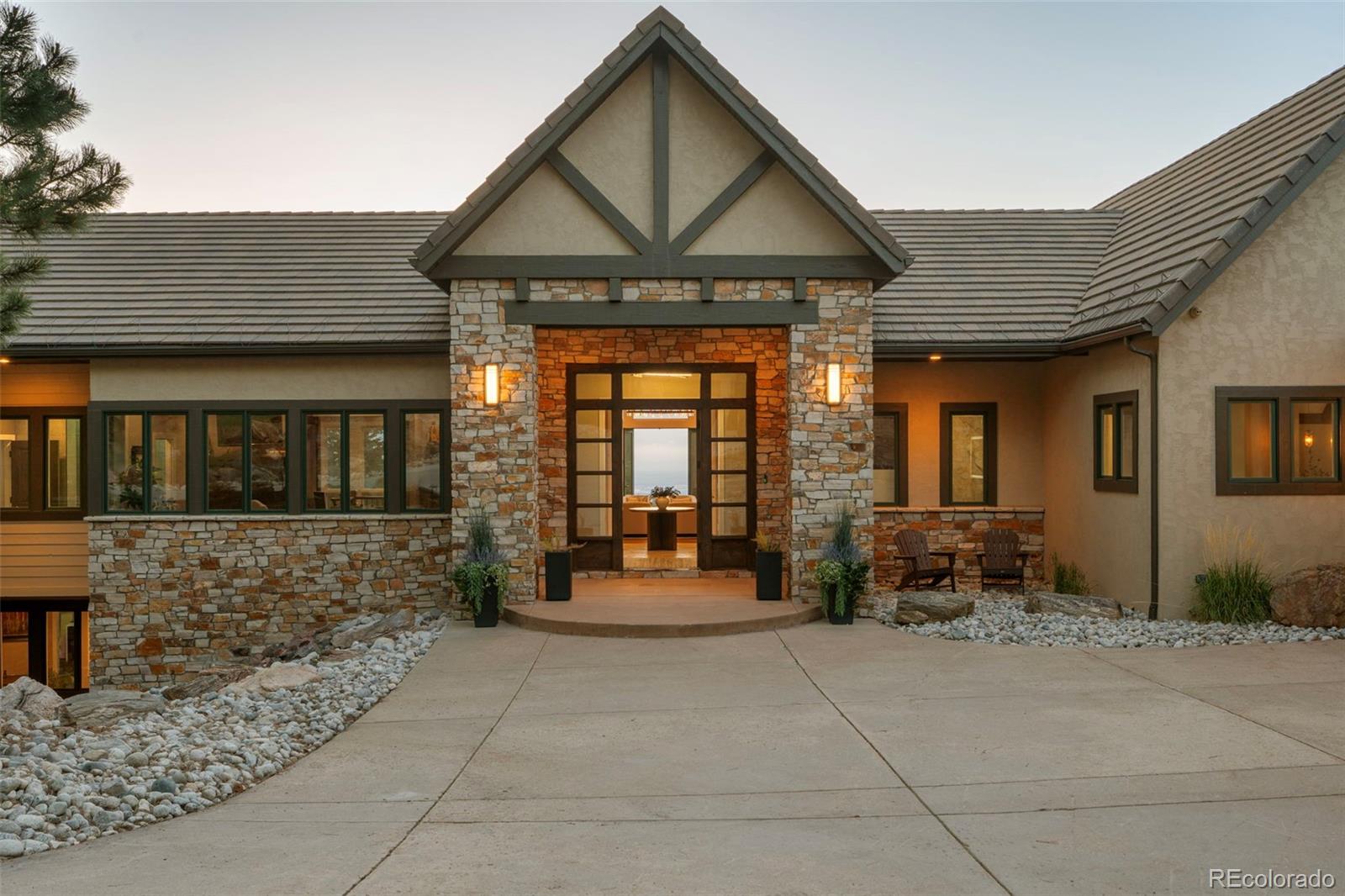 730 Genesee Mountain Road Golden, CO 80401 - Photo 3 of 50 a front view of a house with outdoor seating