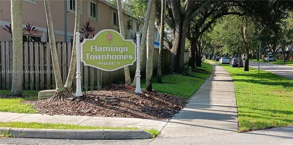 a sign board with a small yard