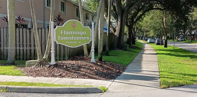 a sign board with a small yard