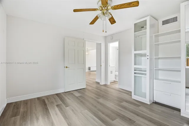 a spacious bedroom with a large window