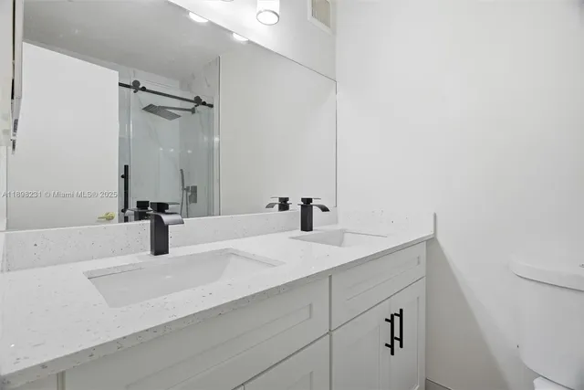 a view of a bathroom from the hallway