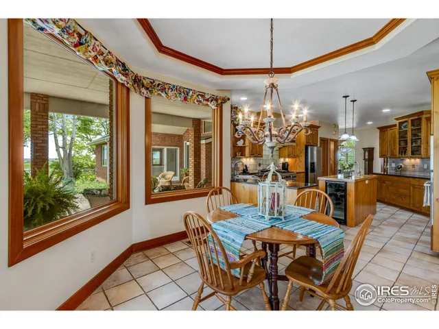 a bedroom with a bed next to a window