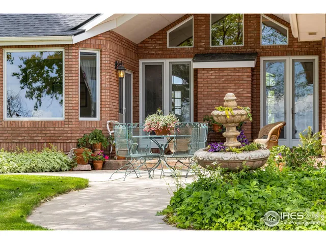 a living room with furniture a window and a fireplace