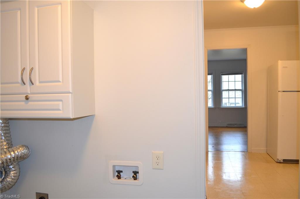 2802 Holmes Road Greensboro, NC 27405 - Photo 10 of 23 laundry into kitchen