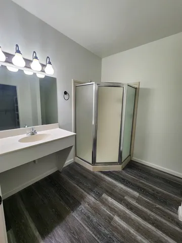 a bathroom with a double vanity sink and a mirror