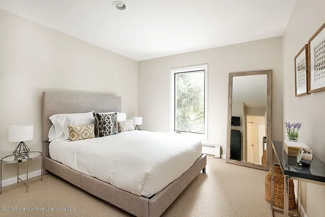 a bathroom with a bathtub and a window