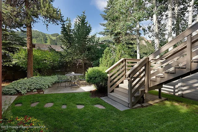 a view of a bench in a garden