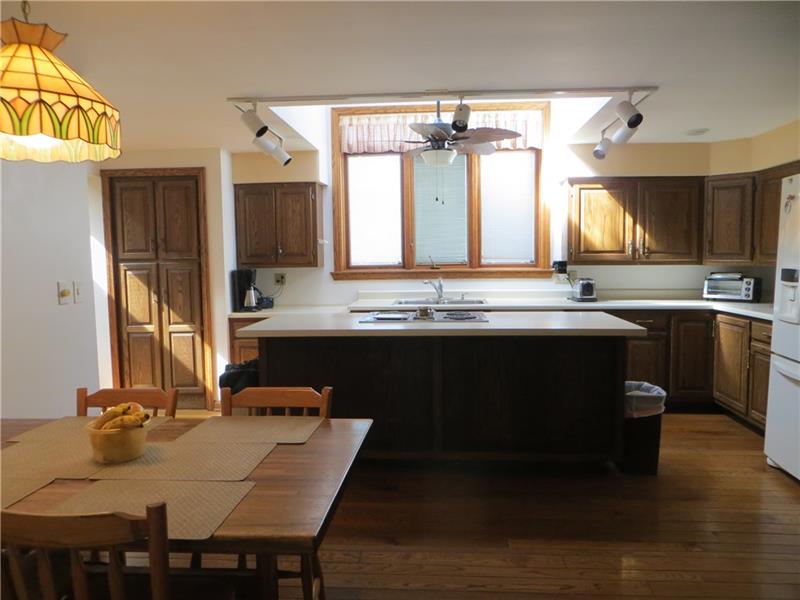 700 Field Club Road Pittsburgh, PA 15238 - Photo 8 of 20 Features of family room include access to loft area, cathedral ceiling, brick floor to ceiling log burning fireplace.