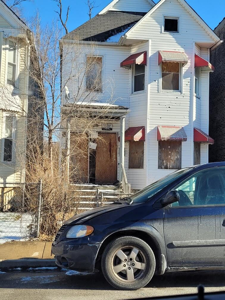 a front view of a house with parking space