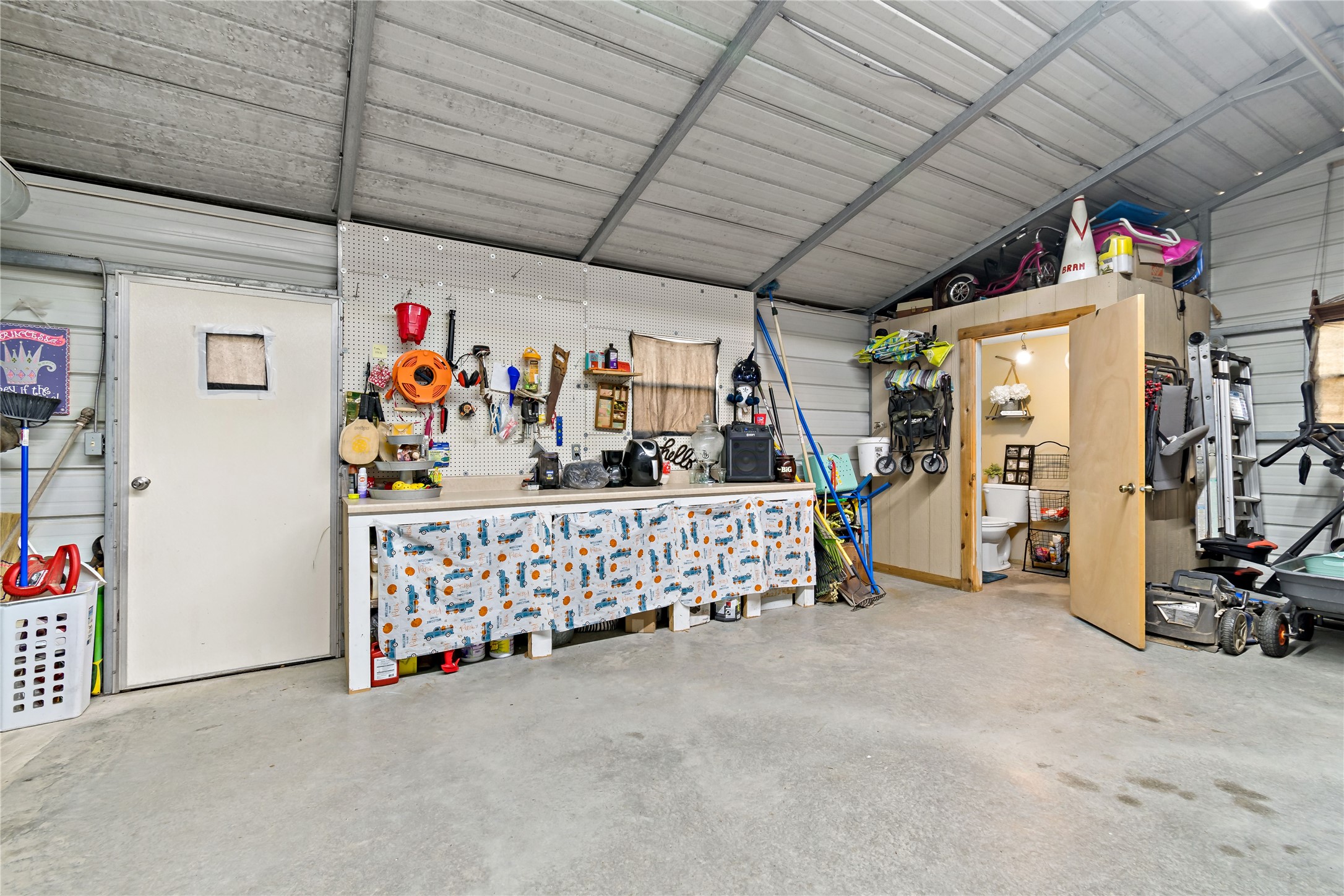 720 Cooke-Jones Road Point Blank, TX 77364 - Photo 22 of 30 Garage with half bath and storage