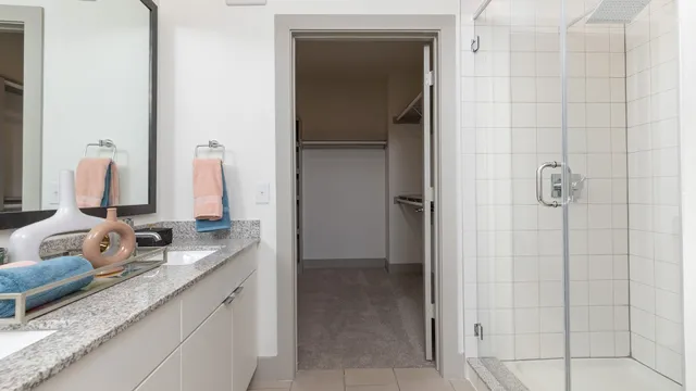 a bathroom with a double vanity sink and a mirror