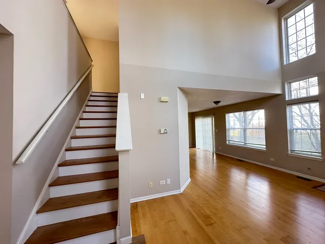 a view of an entryway with wooden floor and windows