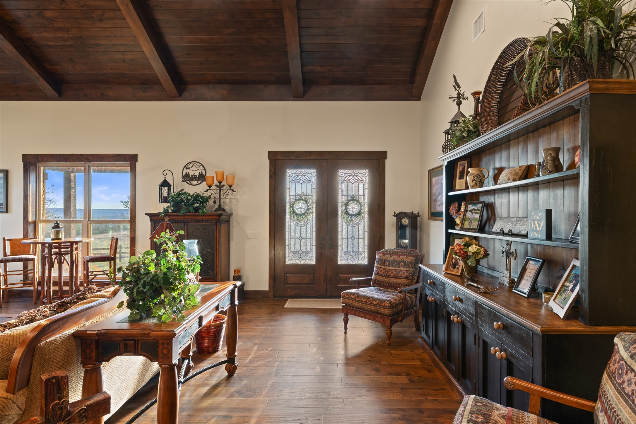 4827 Maenius Road Blanco, TX 78606 - Photo 13 of 23 Entrance foyer featuring french doors, vaulted ceiling with beams, wooden ceiling, dark wood finished floors, and plenty of natural light