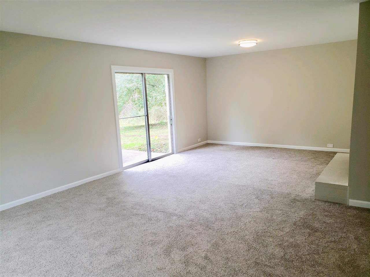 611 Wofford Road Durham, NC 27707 - Photo 25 of 30 Gaming room, Media Room, Play room with Fireplace and exterior entrance and patio Finished basement