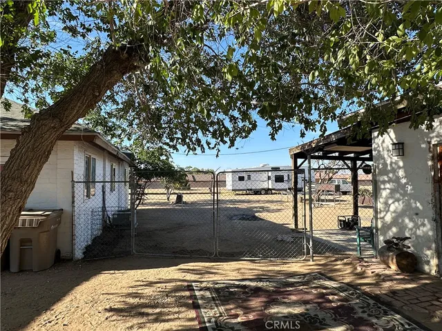 a view of a backyard of the house