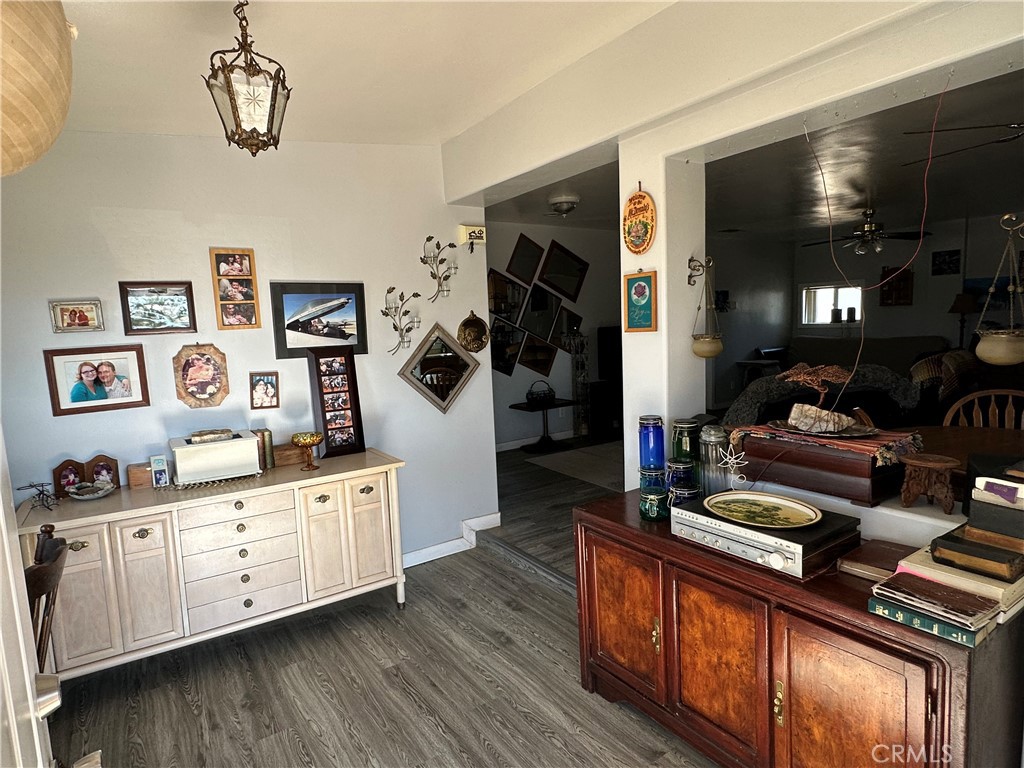 8625 C Avenue Hesperia, CA 92345 - Photo 3 of 29 a kitchen with stainless steel appliances a stove a chimney and cabinets