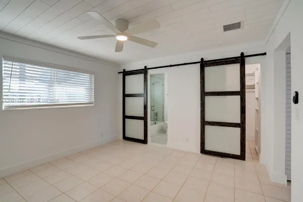 a view of an empty room with a window
