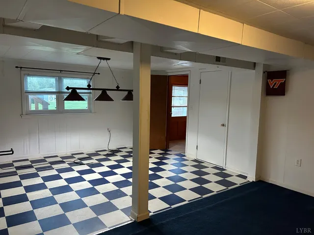 a bathroom with a sink a toilet a mirror and shower