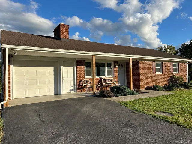 a view of a car parked in front of a house