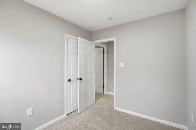 a view of a hallway with closet area