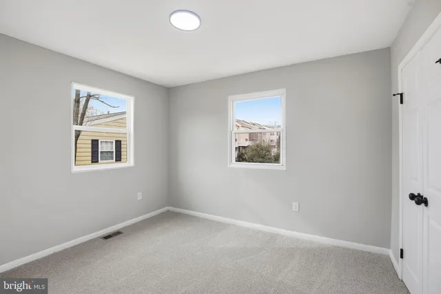 an empty room with windows