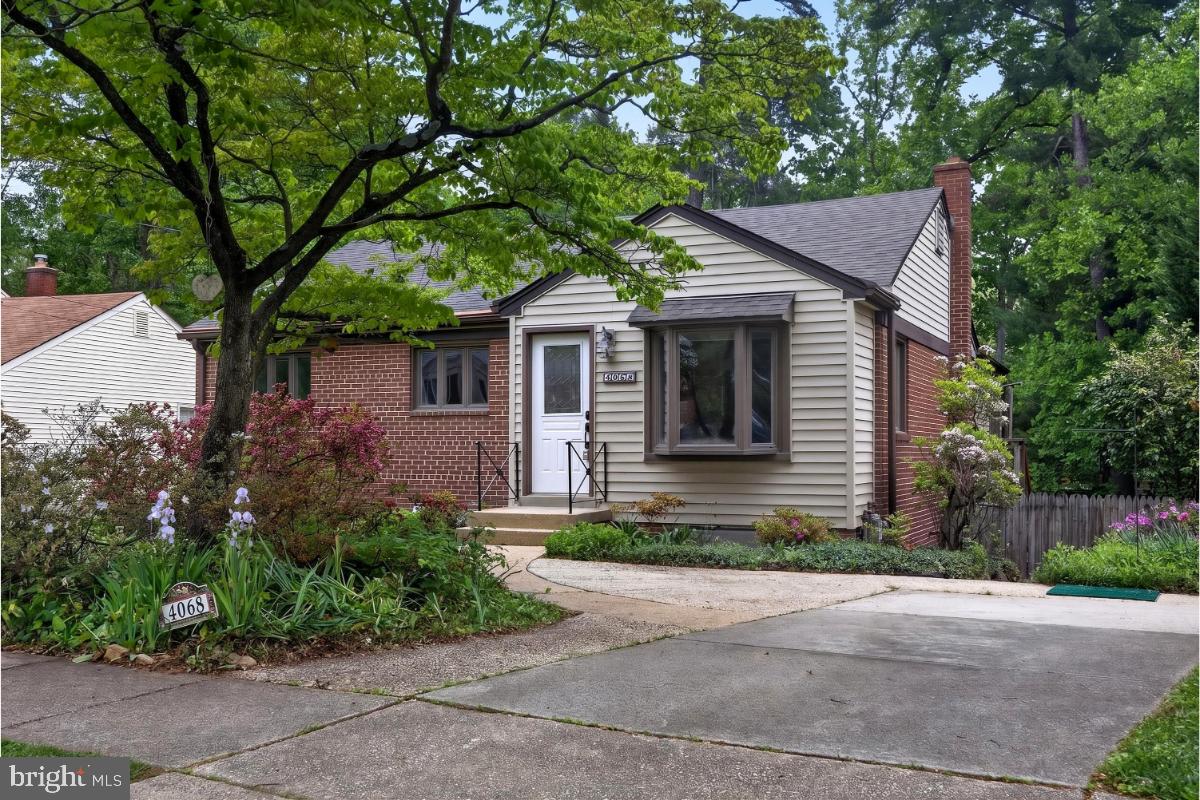 4068 Adams Drive Silver Spring, MD 20902 - Photo 3 of 43 a front view of a house with a yard and potted plants