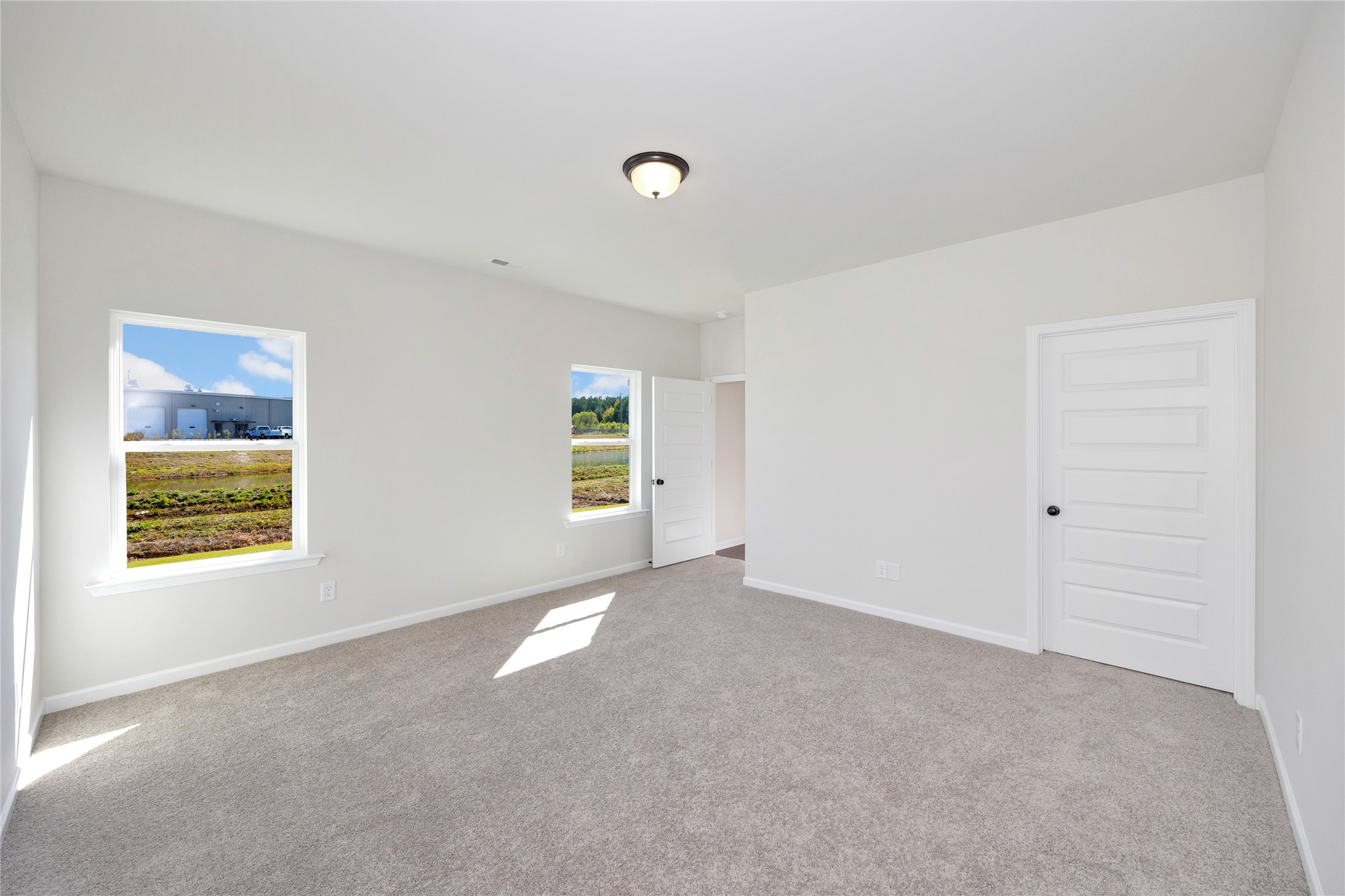 9722 Enclave Ridge Road Willis, TX 77318 - Photo 12 of 20 a view of an empty room with a window