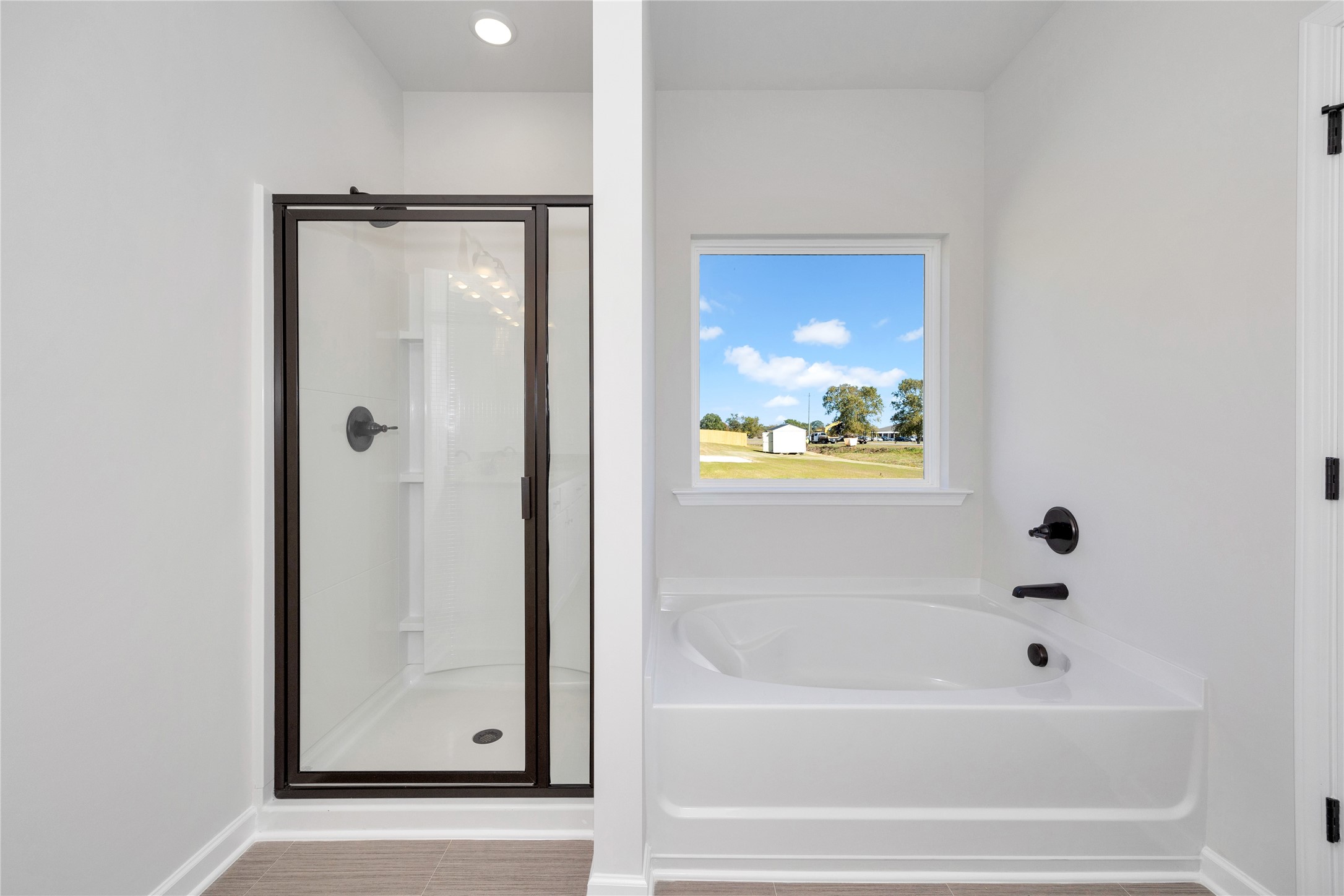 9722 Enclave Ridge Road Willis, TX 77318 - Photo 15 of 20 a bathroom with bathtub and shower