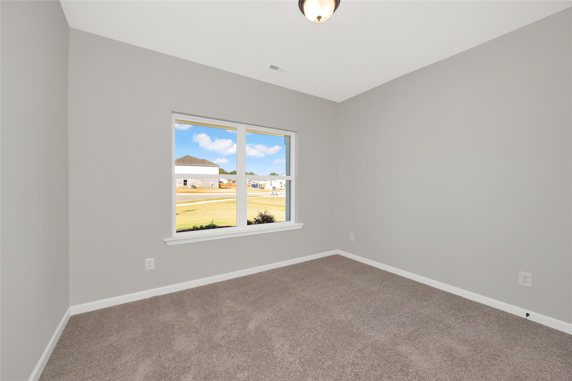 9722 Enclave Ridge Road Willis, TX 77318 - Photo 16 of 20 an empty room with a window