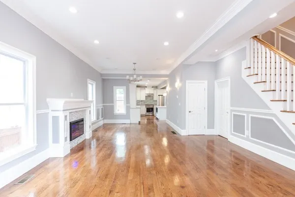 a view of a living room with a fireplace cabinets and a window