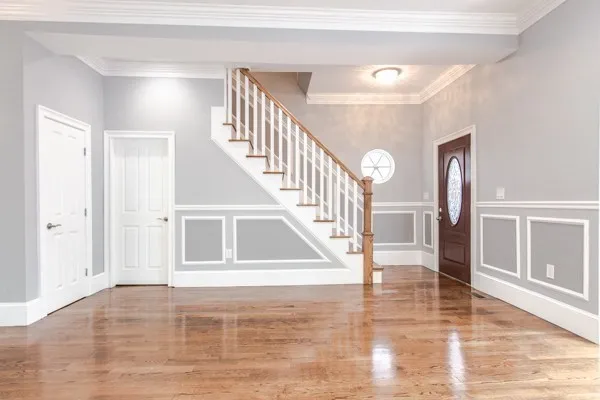 a view of entryway and hall with wooden floor