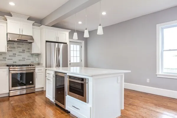 a kitchen with a stove and a refrigerator