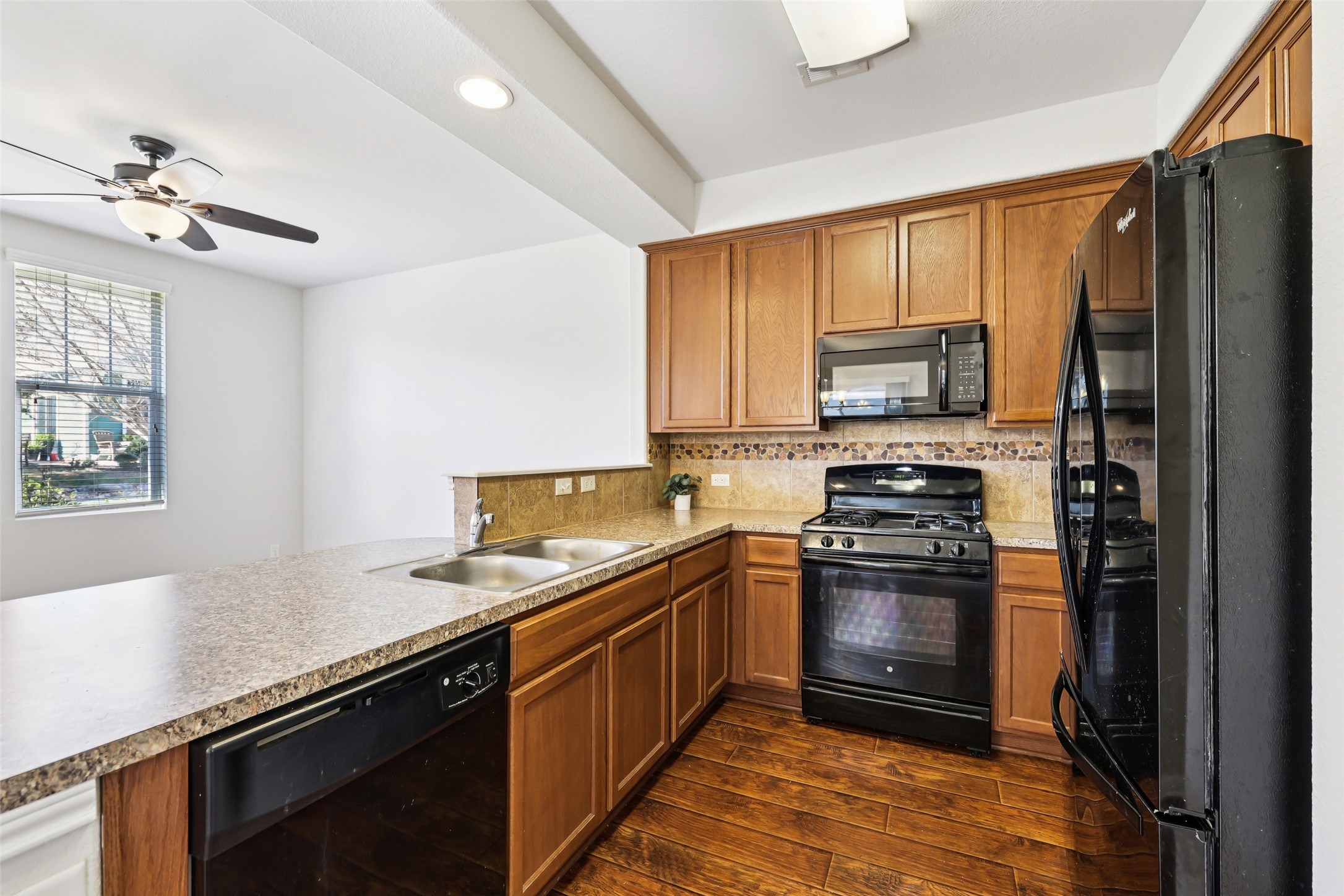 1524 Sanders Kyle, TX 78640 - Photo 12 of 37 a kitchen with a sink stove and refrigerator