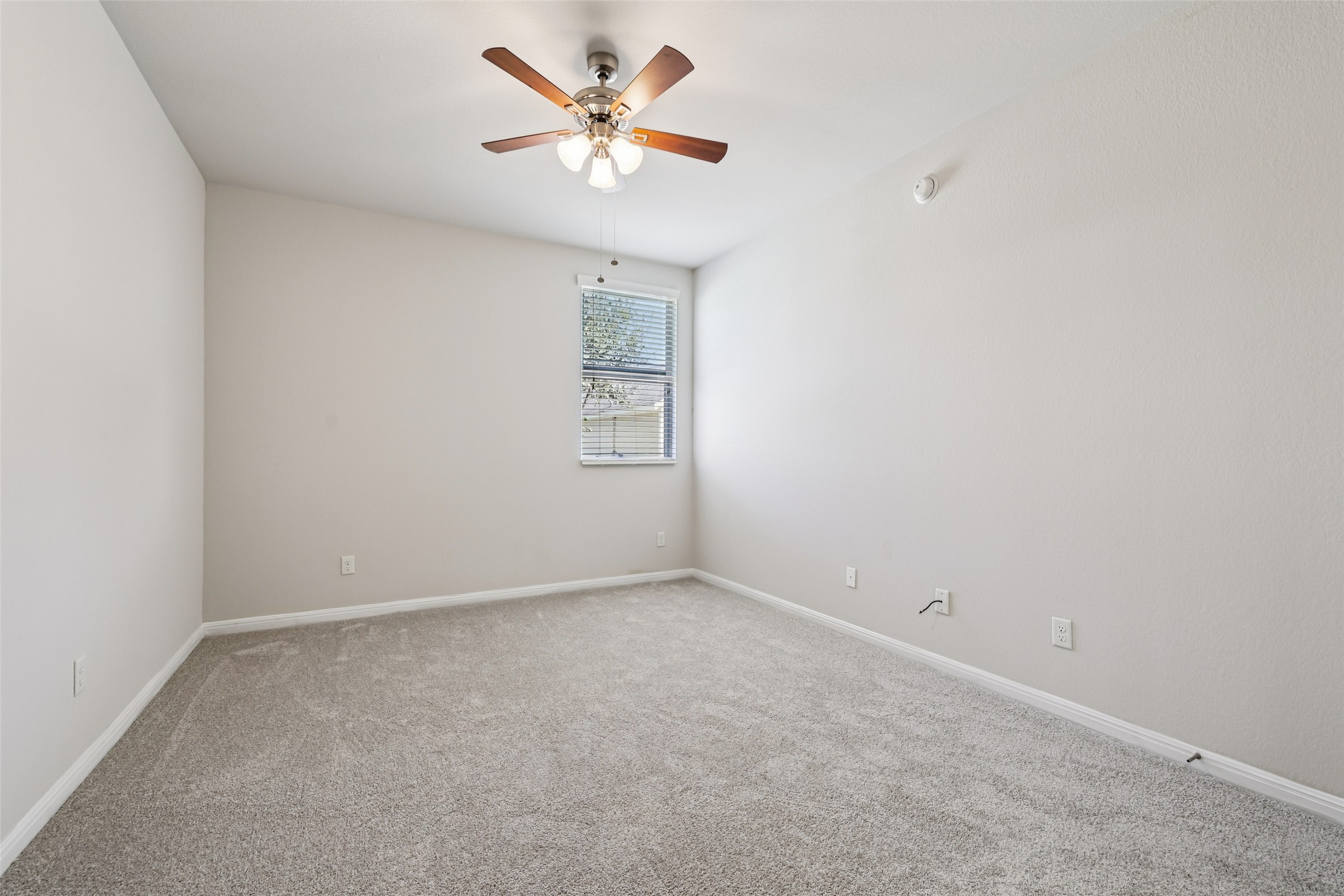 1524 Sanders Kyle, TX 78640 - Photo 16 of 37 an empty room with a window and a fan