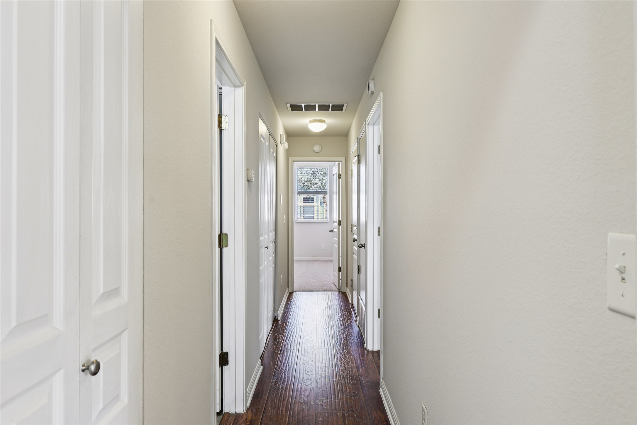 1524 Sanders Kyle, TX 78640 - Photo 24 of 37 a view of a hallway with wooden floor