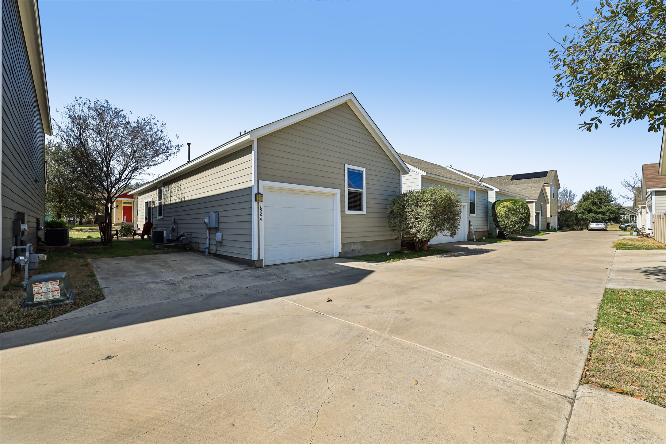 1524 Sanders Kyle, TX 78640 - Photo 28 of 37 a view of garage yard and tree
