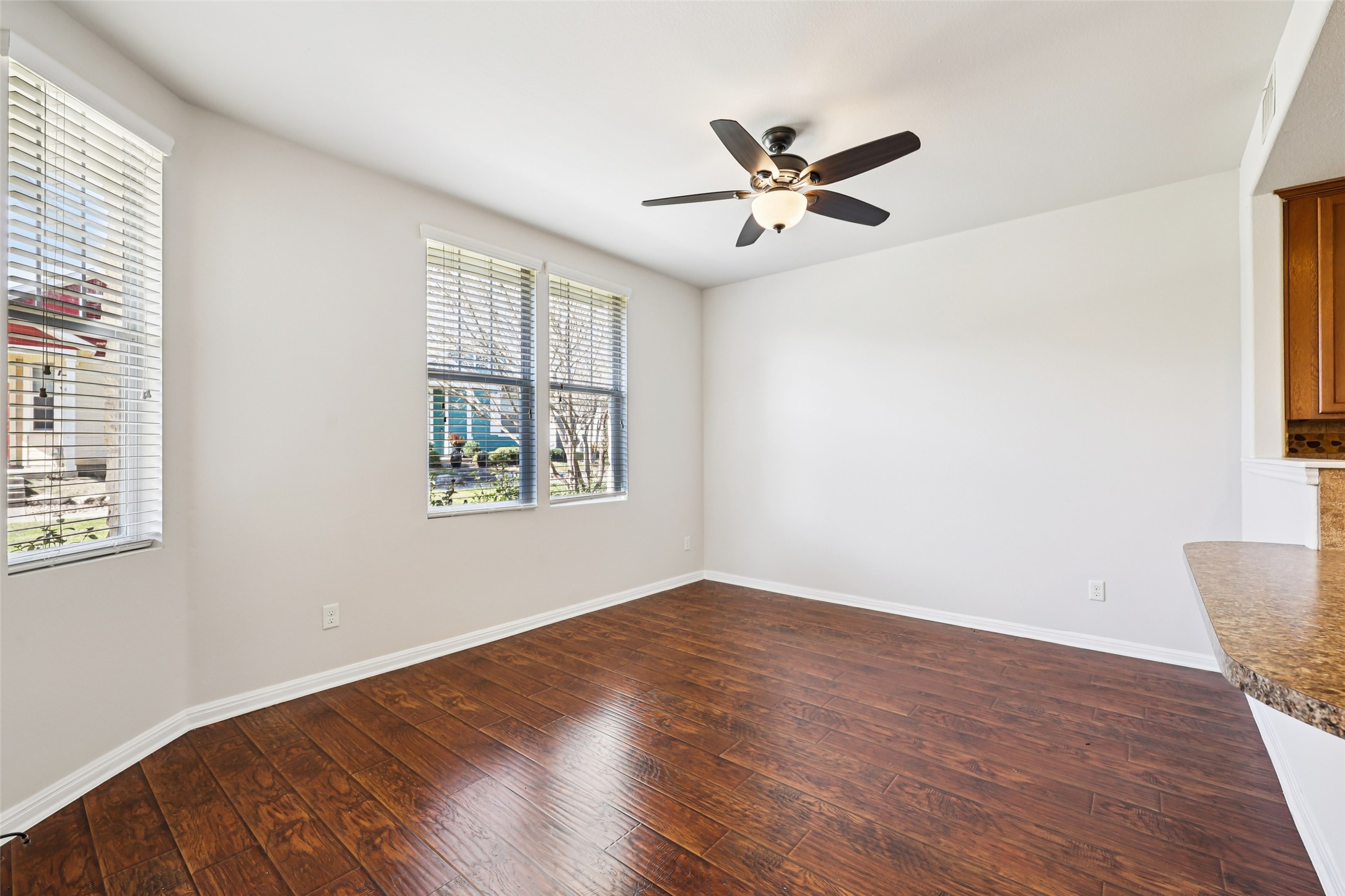 1524 Sanders Kyle, TX 78640 - Photo 34 of 37 a view of empty room with wooden floor and fan