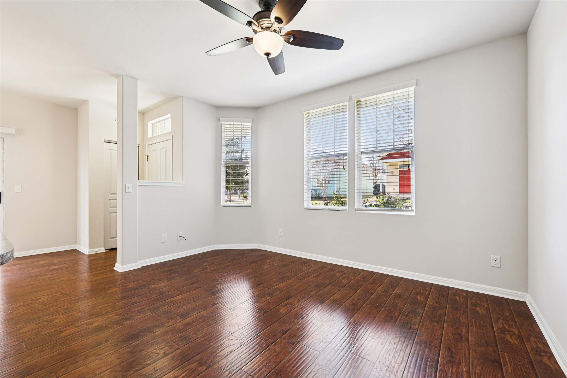 1524 Sanders Kyle, TX 78640 - Photo 7 of 37 a view of empty room with wooden floor and fan