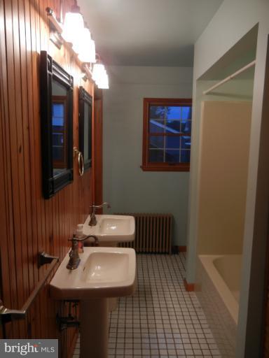 111 Homewood Road Linthicum Heights, MD 21090 - Photo 10 of 14 a bathroom with a sink and a mirror