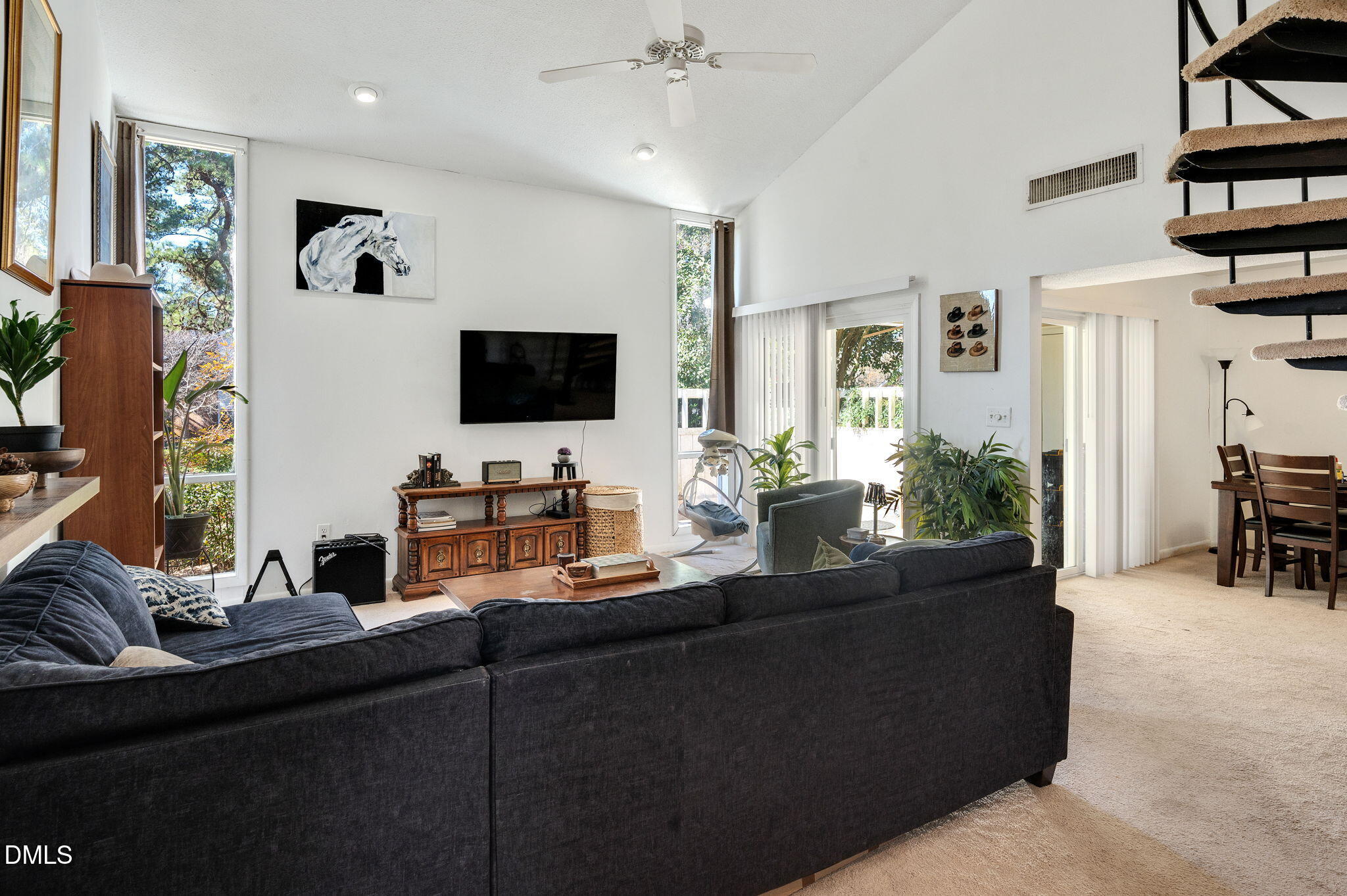 4603 Edwards Mill Road Raleigh, NC 27612 - Photo 4 of 26 a living room with furniture and a flat screen tv