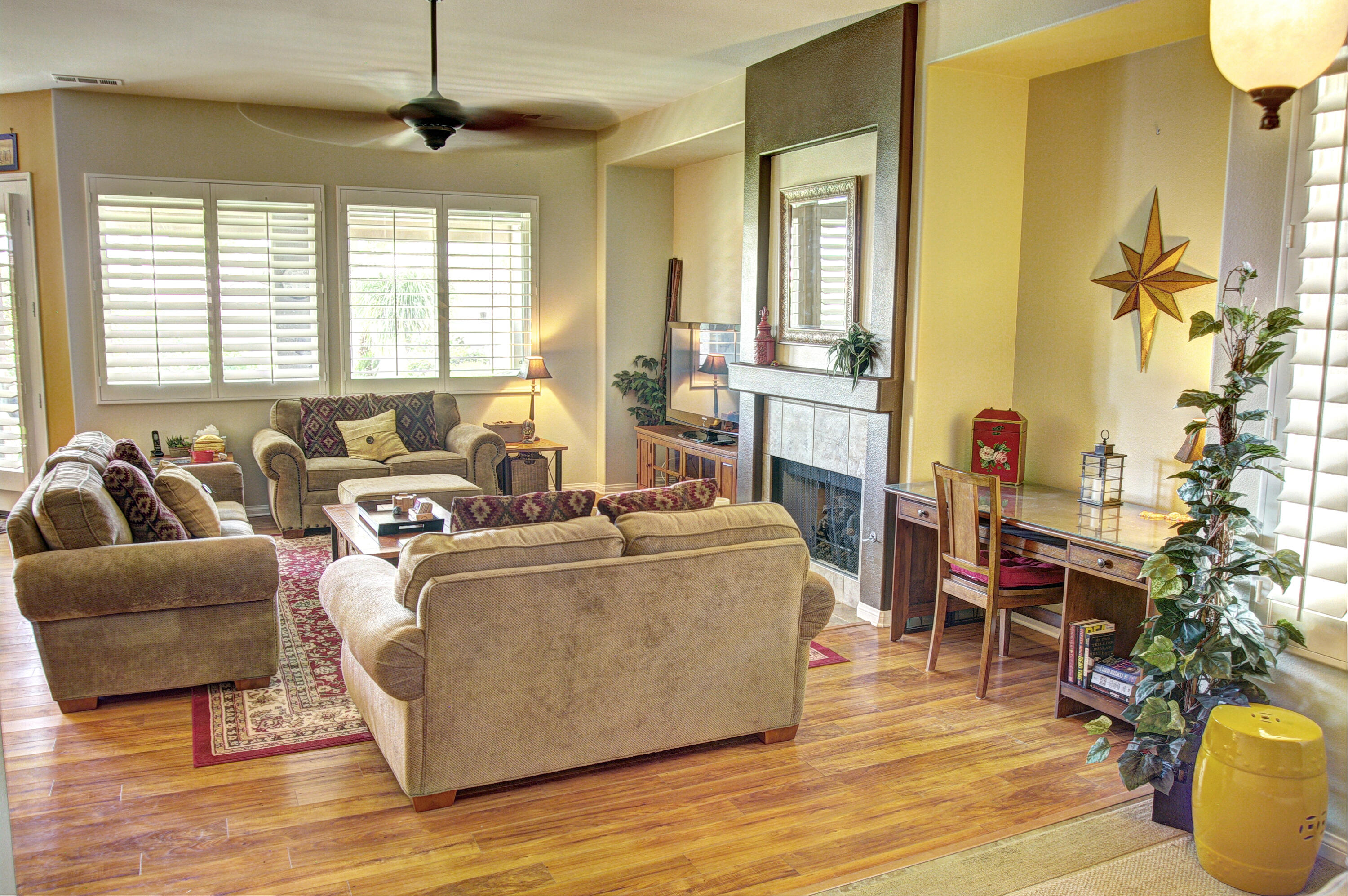 82799 Burnette Drive Indio, CA 92201 - Photo 11 of 36 a living room with furniture and a large window