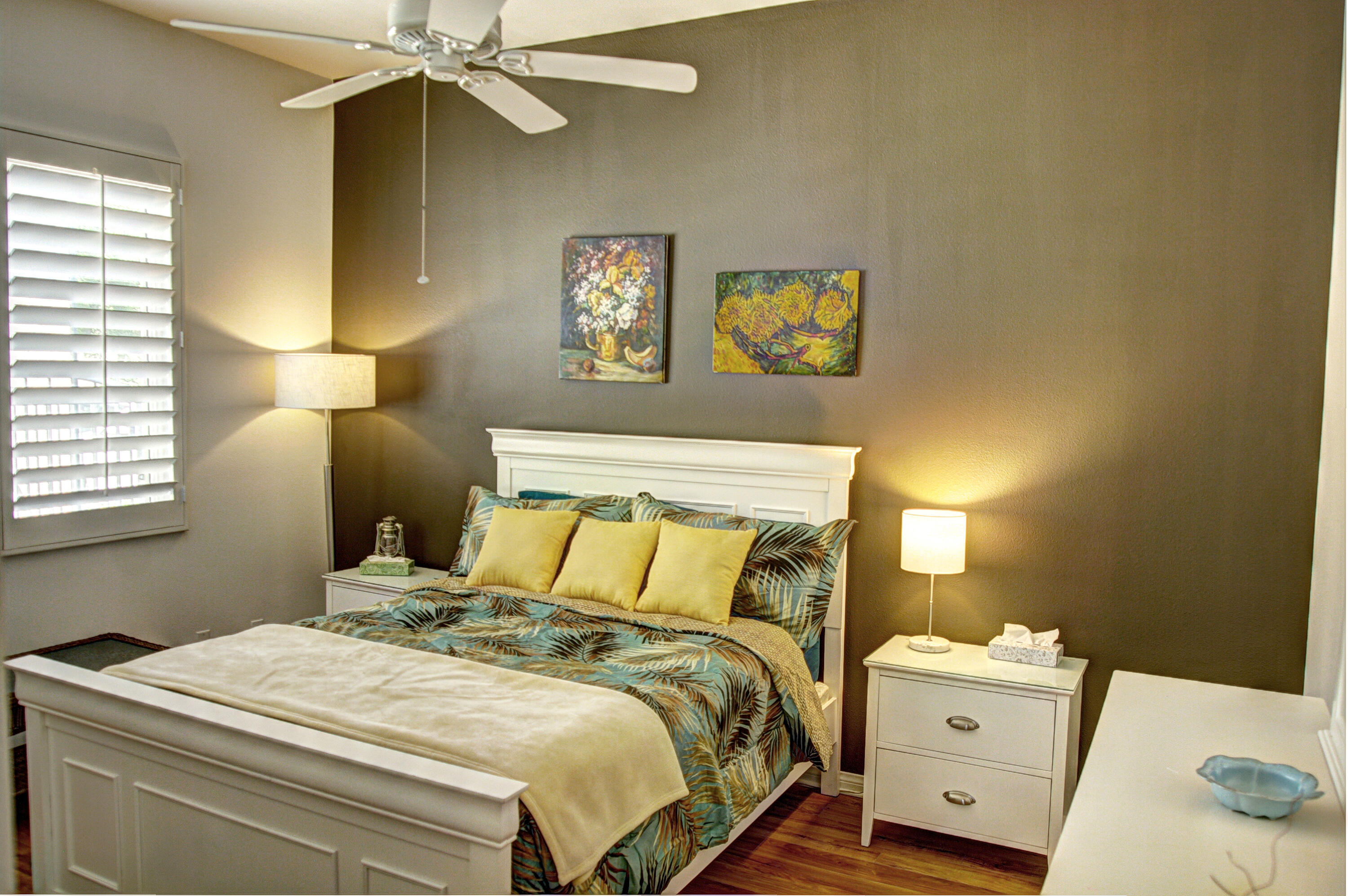 82799 Burnette Drive Indio, CA 92201 - Photo 13 of 36 a bedroom with a bed and a chandelier