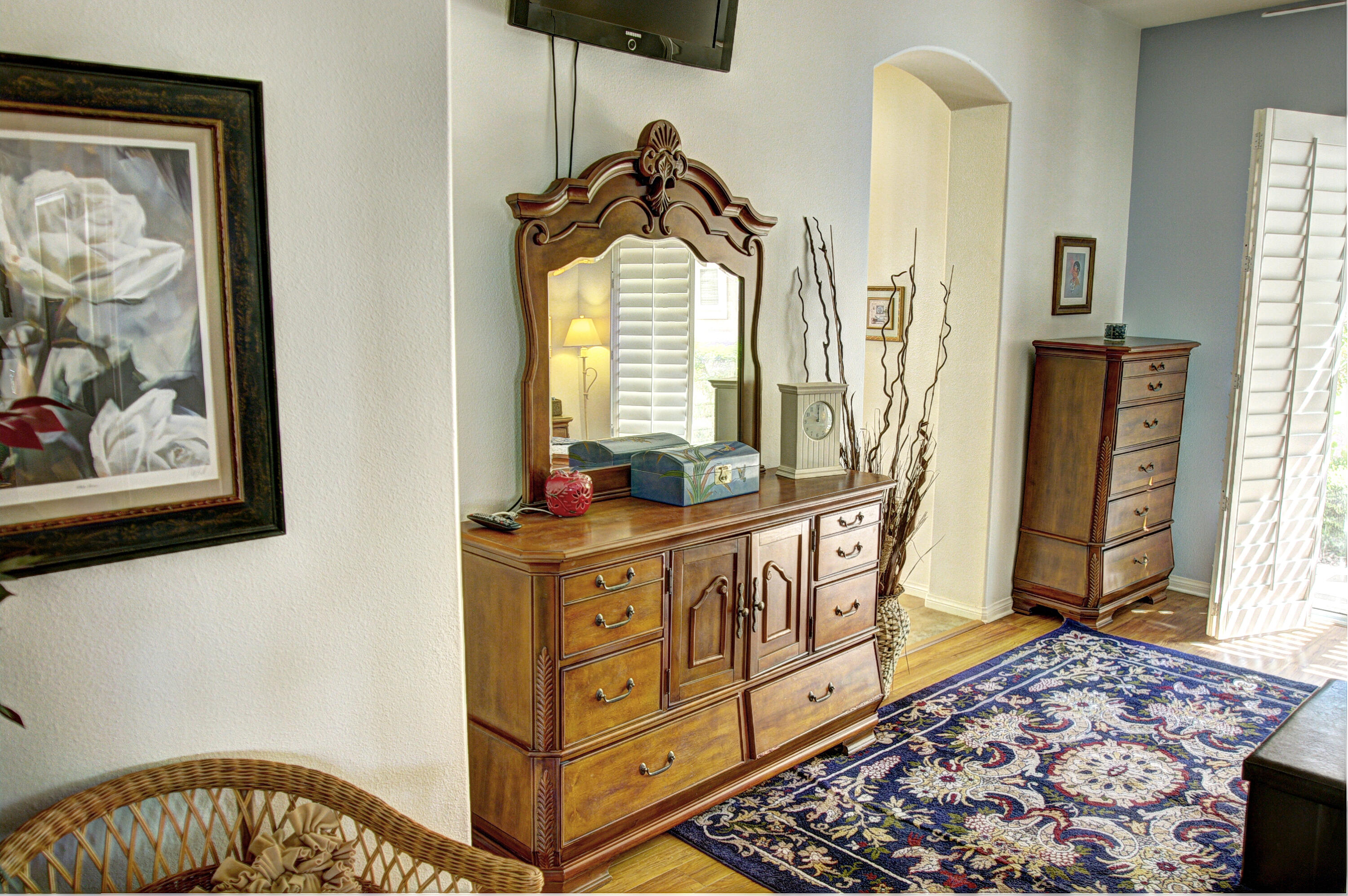 82799 Burnette Drive Indio, CA 92201 - Photo 18 of 36 a view of a hallway with wooden floor and windows