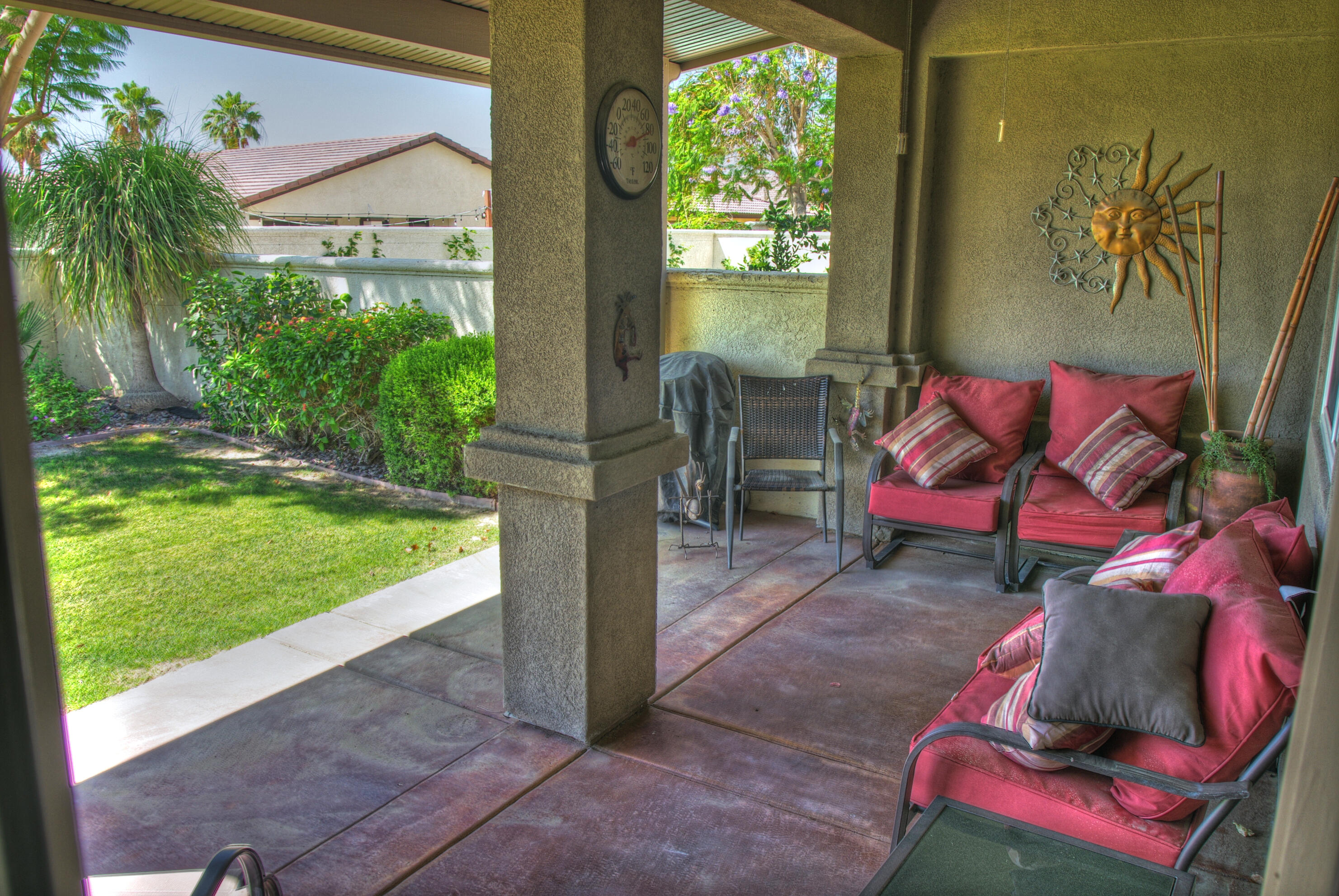 82799 Burnette Drive Indio, CA 92201 - Photo 28 of 36 a backyard of a house with seating space