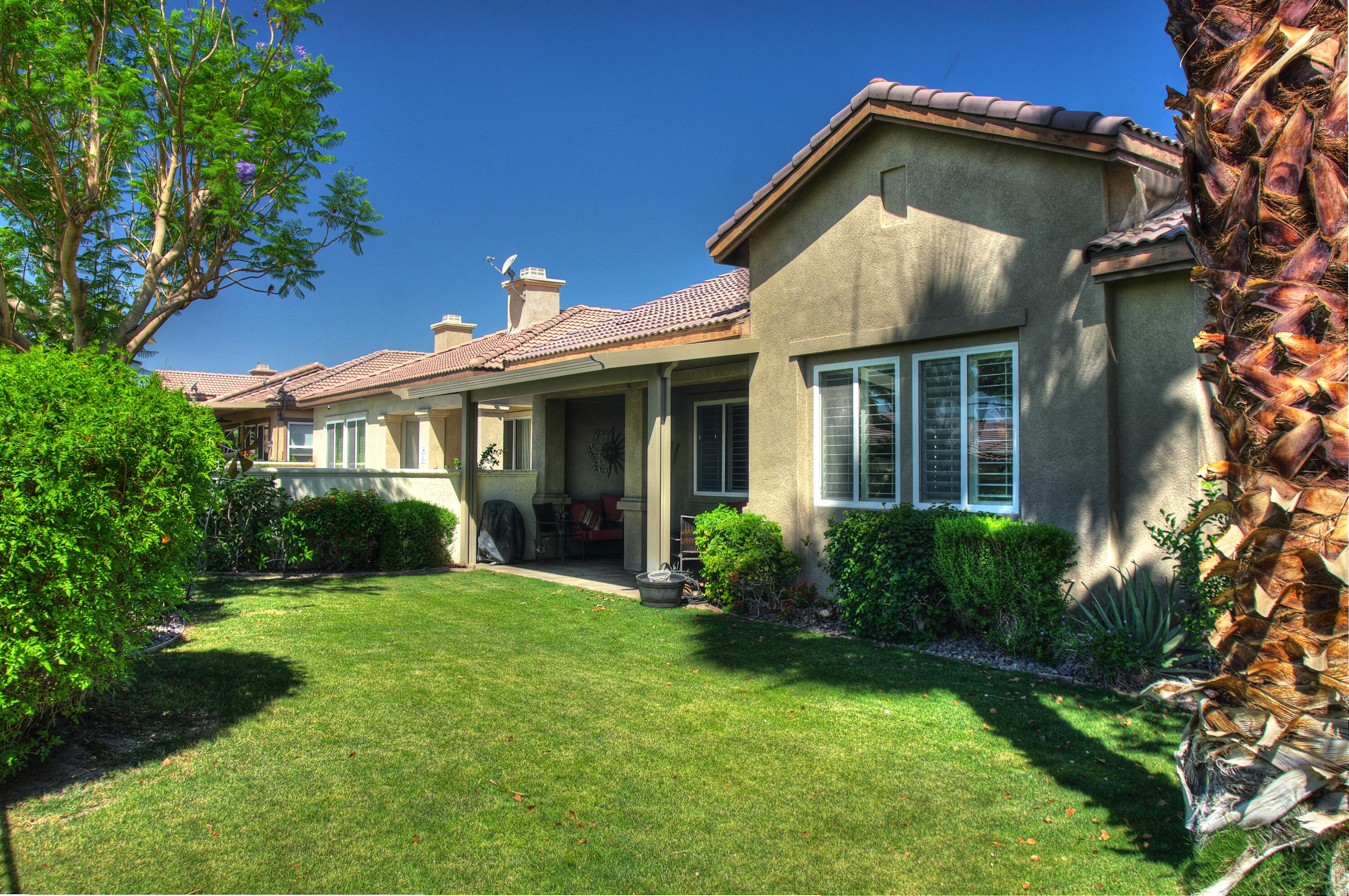 82799 Burnette Drive Indio, CA 92201 - Photo 31 of 36 front view of a house with a yard