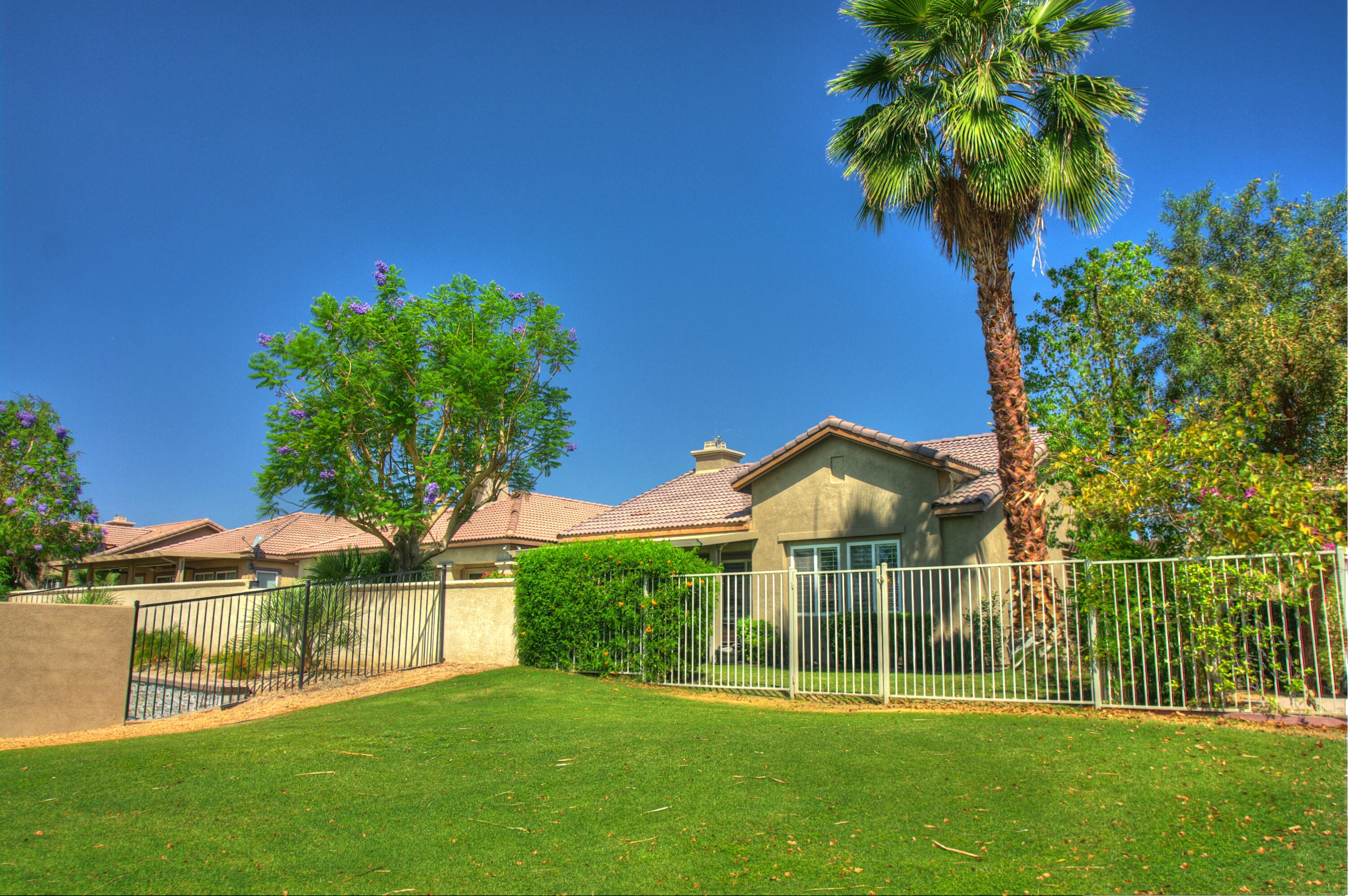 82799 Burnette Drive Indio, CA 92201 - Photo 33 of 36 front view of a house with a big yard