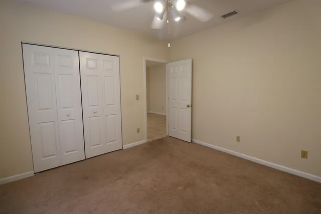 an empty room with fan